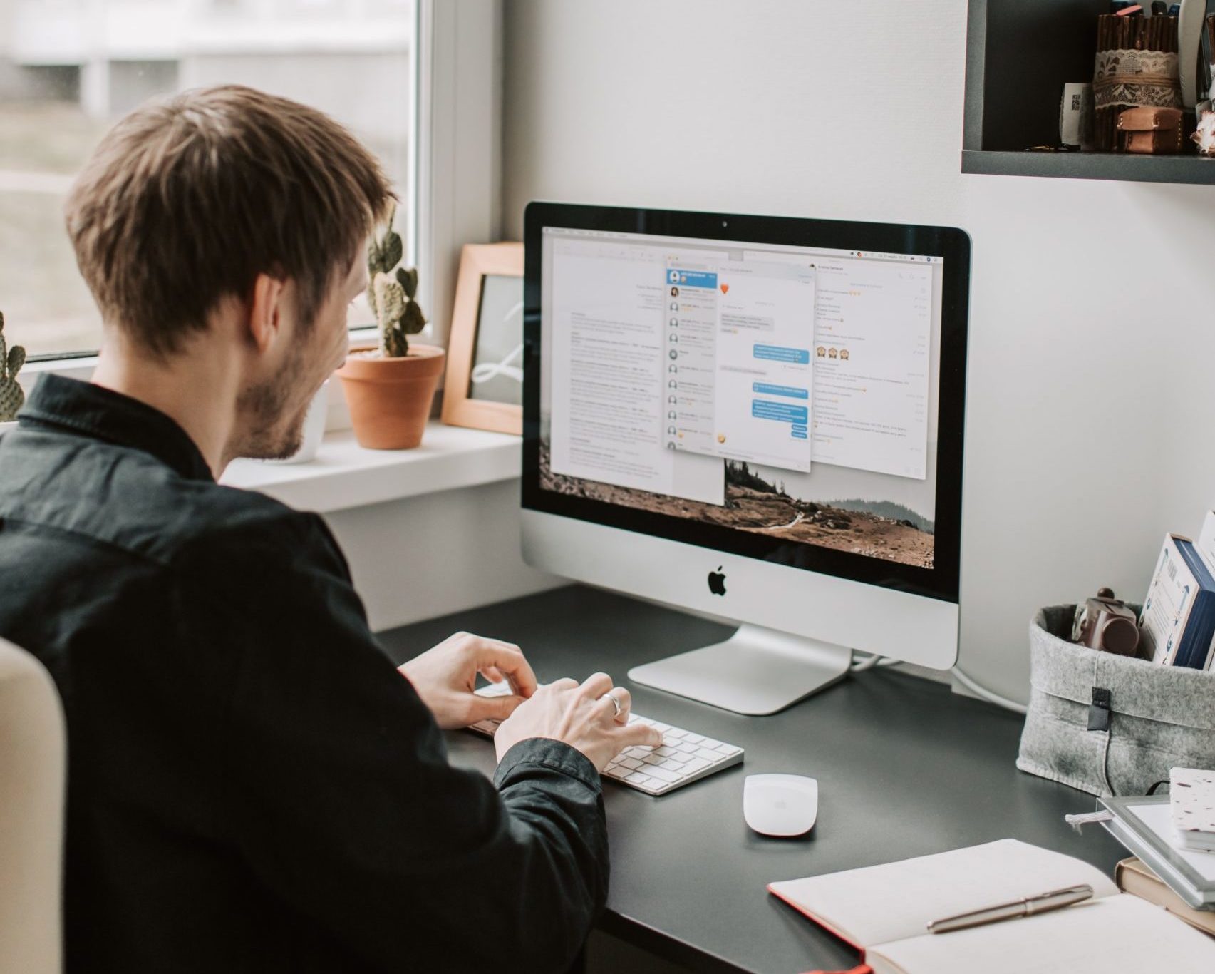 man on desktop computer