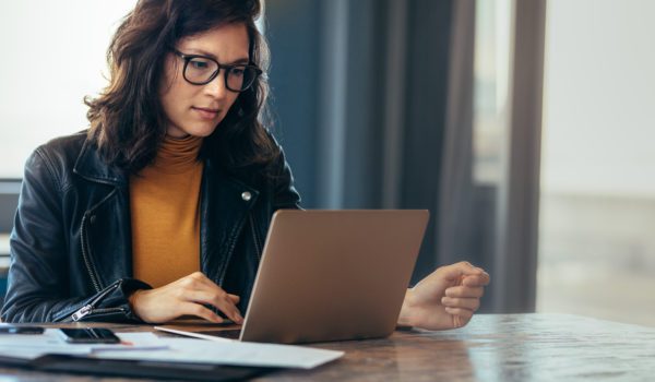 A person looking down at their laptop.