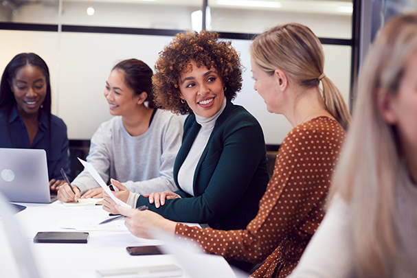 A group of women collaborating on an SEO vs PPC project.